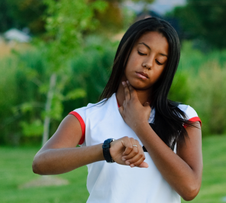 A woman checking her pulse